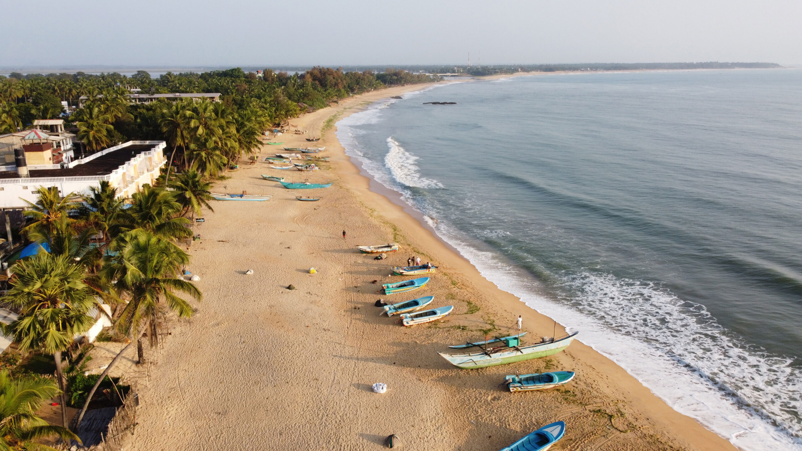 Unawatuna Beach Sri Lanka - crescent-shaped bay with palm trees and turquoise waters